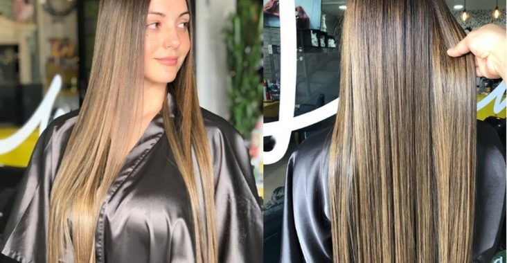 Hair straightened by flat iron in salon