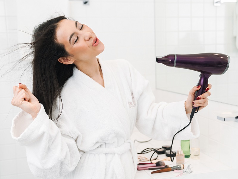 drying hair with blow dry
